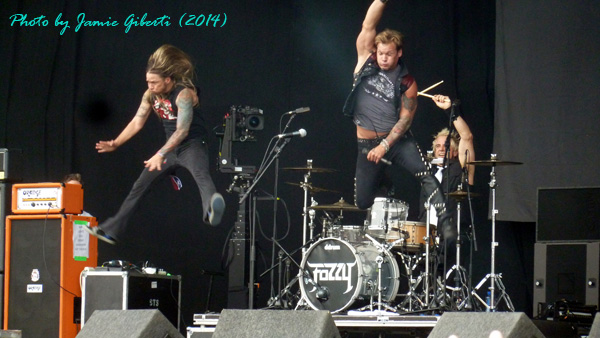Rich & Chris from Fozzy jumping off the drumkit on stage at Download Festival 2014